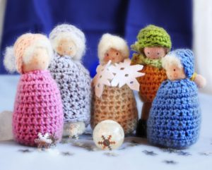 Knitted toy carol singers