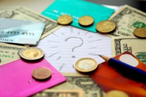 Question mark surrounded by money for commercial rent review